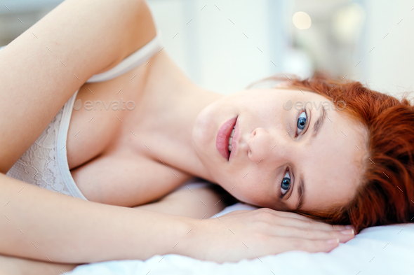 Beautiful Red Haired Woman Lying On Bed Stock Photo By Nd Photodune